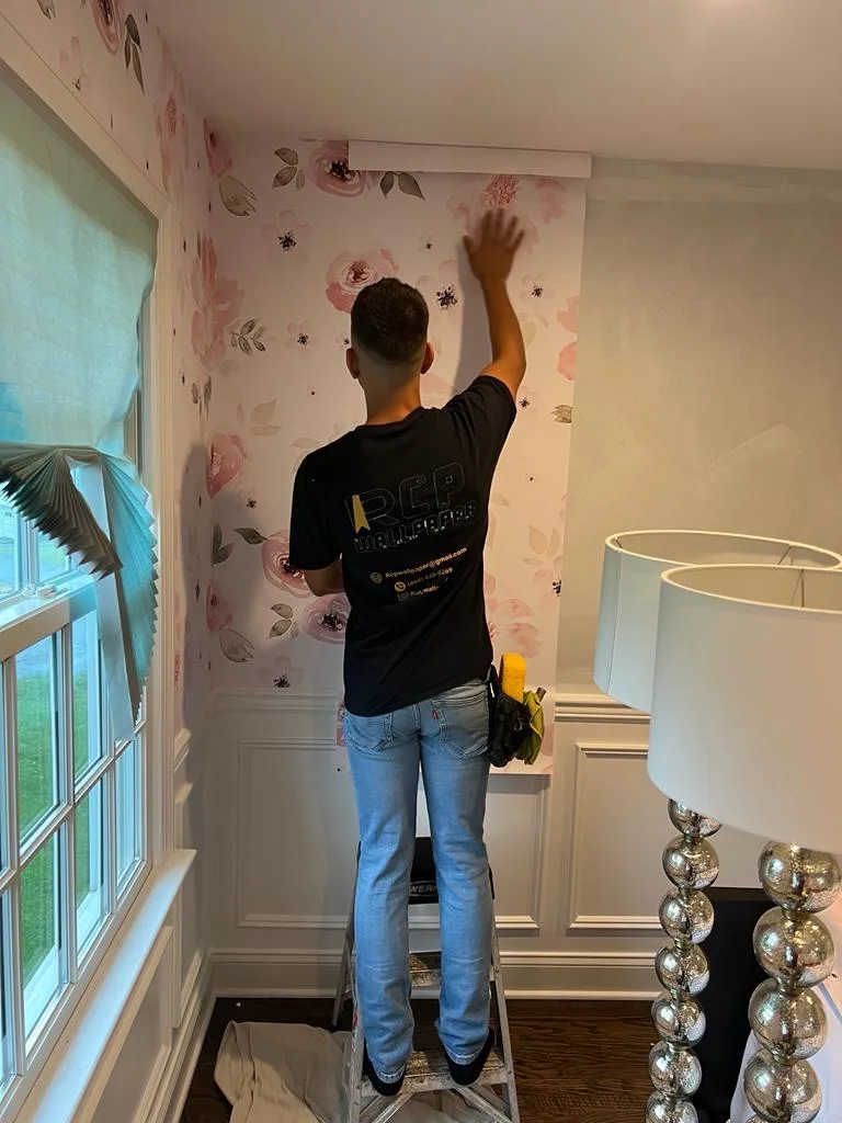 RCP Wallpaper installer hanging floral wallpaper in a New Jersey home