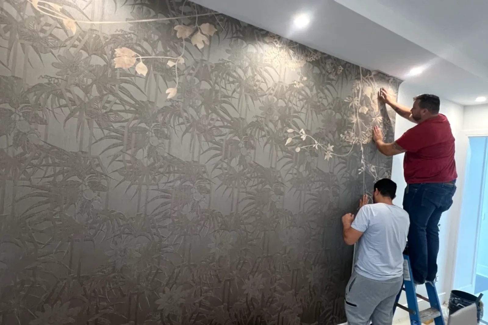 Professional Applying Wallpaper In The Kitchen