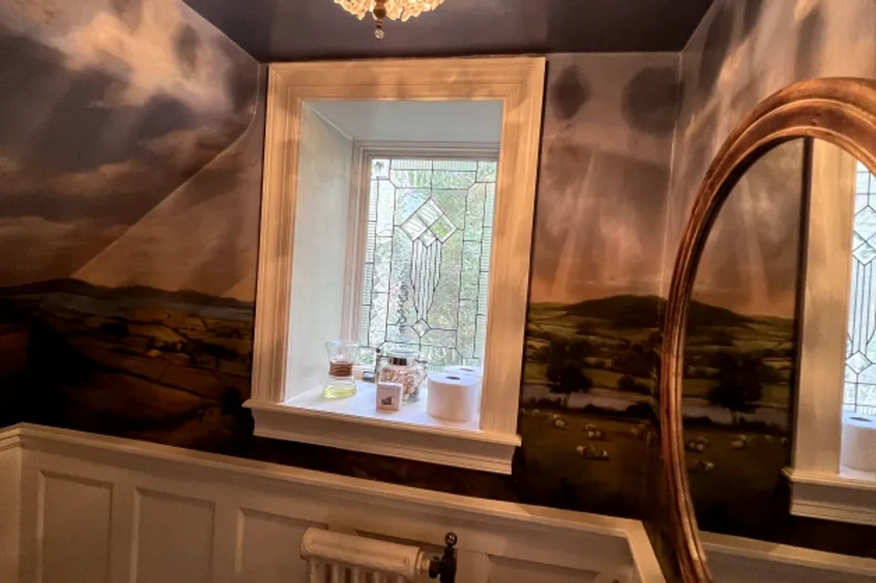 Bold statement wallpaper installation in a powder room by RCP Wallpaper